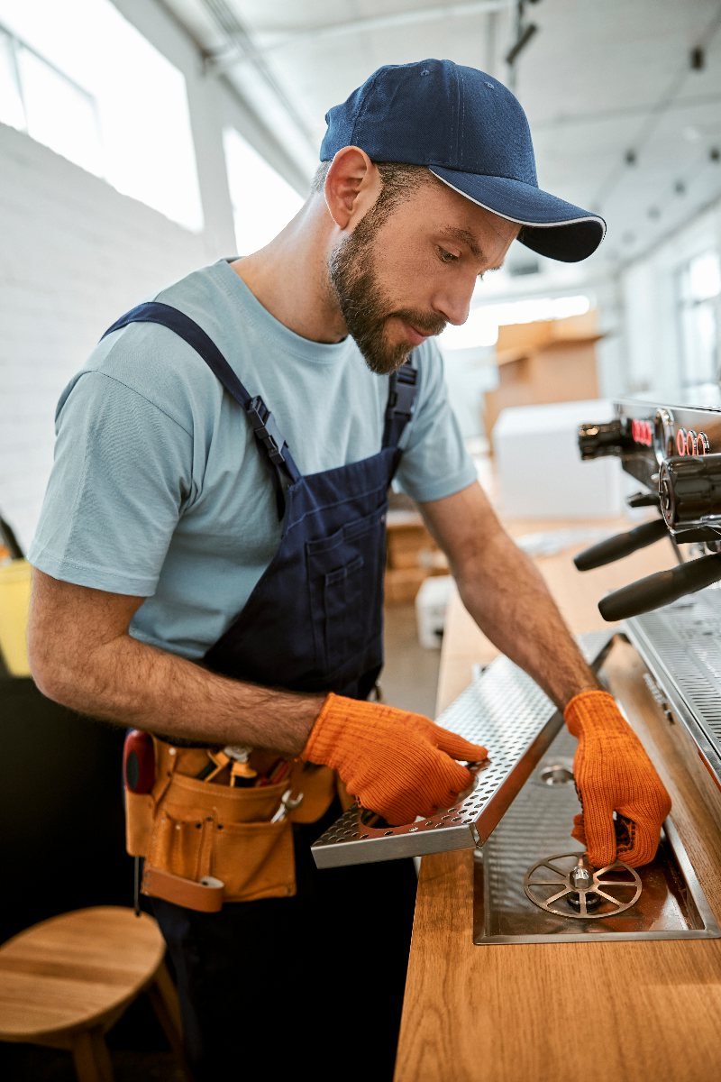 Coffee Lady engineer servicing a commercial coffee machine