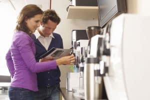 A businessman looking at newly bought office coffee machine from CoffeeLady