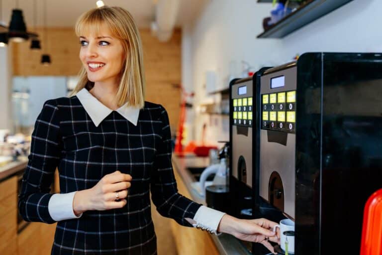 Business Woman Using a Commercial Coffee Machine